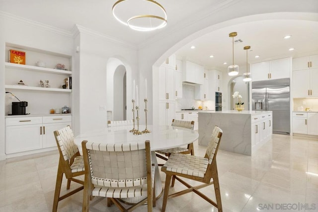 dining room with crown molding