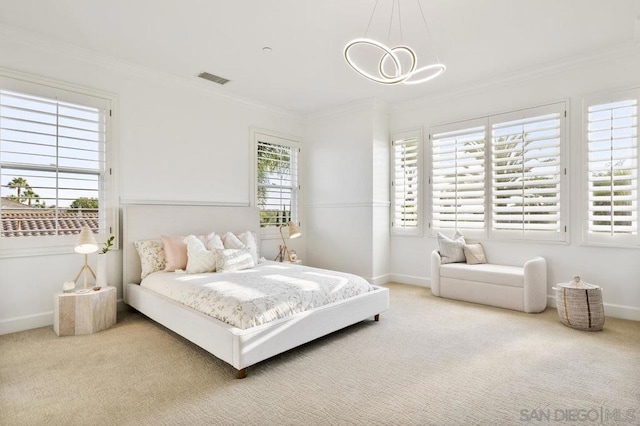 carpeted bedroom featuring crown molding