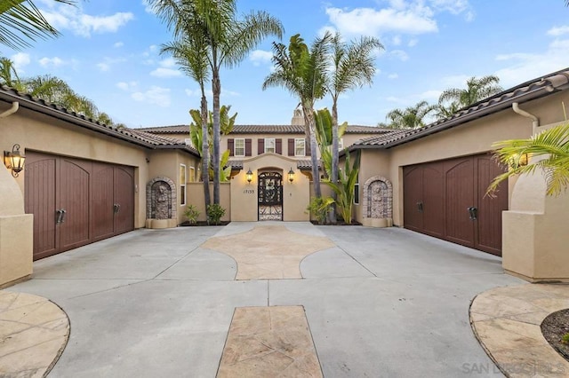 mediterranean / spanish-style house featuring a garage