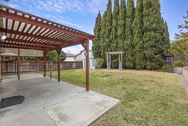 view of yard with a pergola, a patio area, and a storage unit