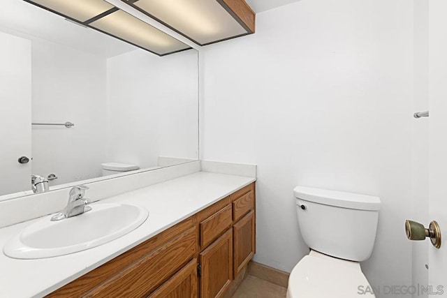 bathroom with toilet and vanity