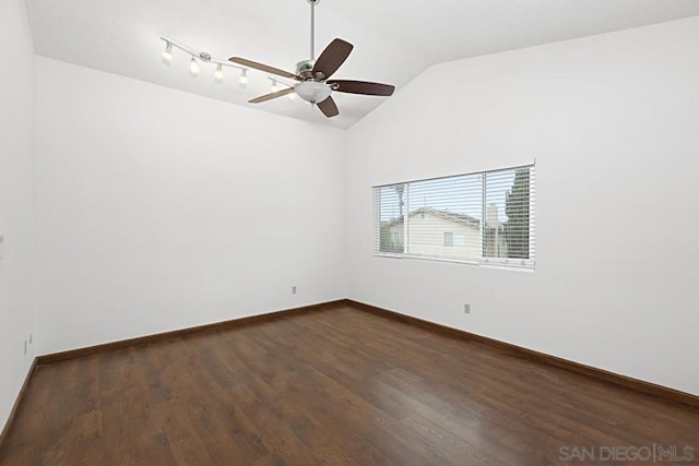 unfurnished room with ceiling fan, dark hardwood / wood-style flooring, and vaulted ceiling