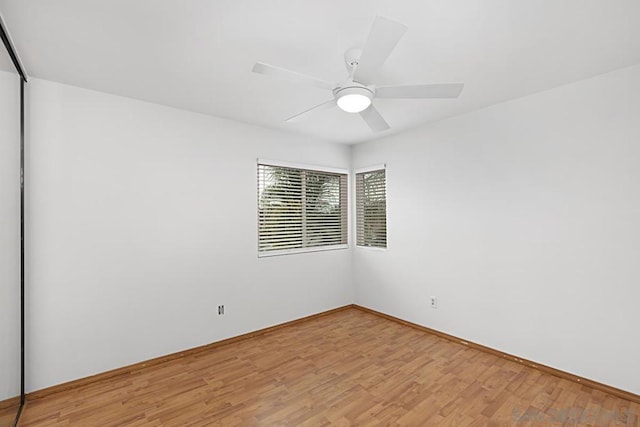 unfurnished room with ceiling fan and light wood-type flooring