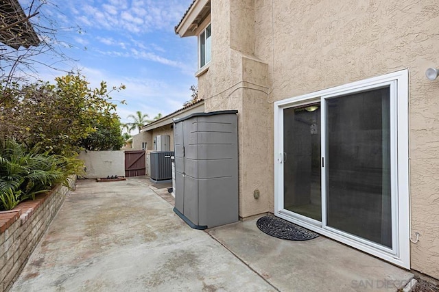 exterior space with a patio area and cooling unit