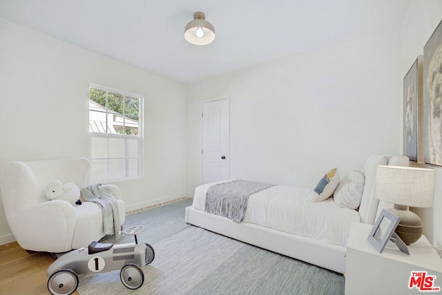 bedroom featuring hardwood / wood-style floors