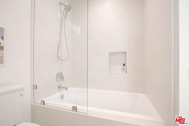 bathroom featuring toilet and bathtub / shower combination