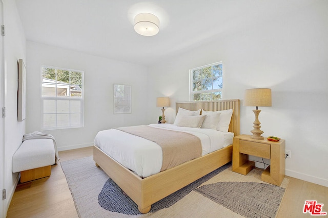 bedroom with light hardwood / wood-style floors