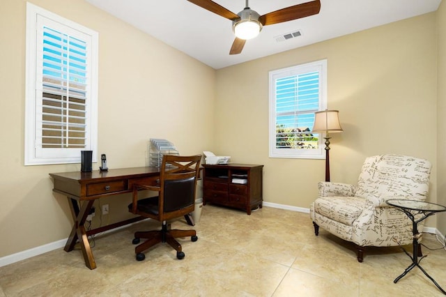 tiled home office with ceiling fan