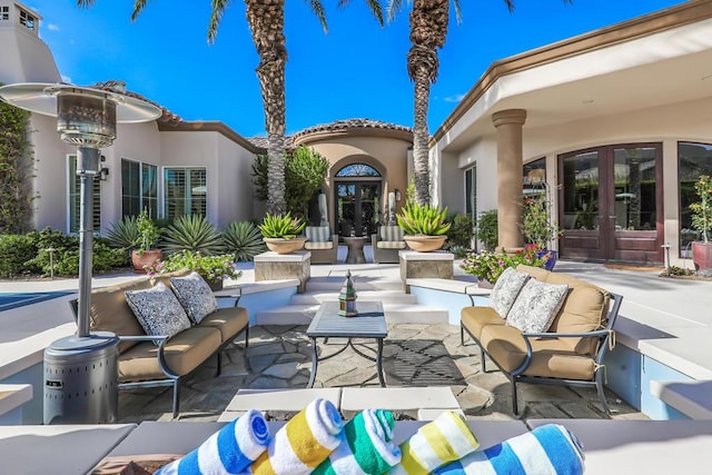 view of patio featuring french doors and an outdoor living space