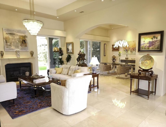 living room featuring a notable chandelier and light tile patterned floors