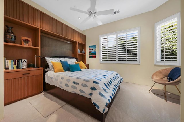 carpeted bedroom with ceiling fan