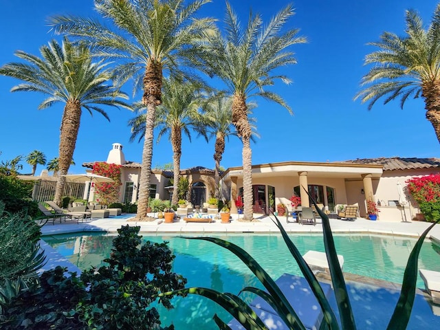 view of pool featuring a patio