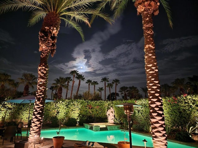 view of pool featuring an in ground hot tub