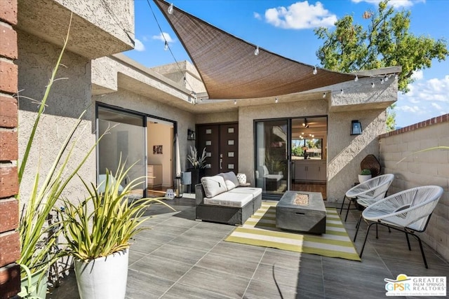 exterior space with a patio area and an outdoor living space with a fire pit