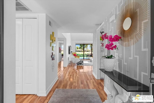 hallway with light wood-type flooring