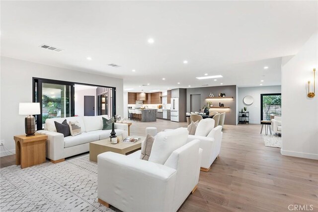 living room with light hardwood / wood-style floors