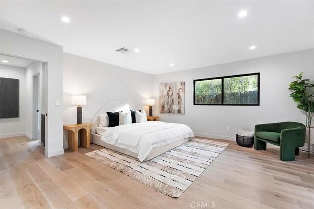 bedroom with light hardwood / wood-style flooring