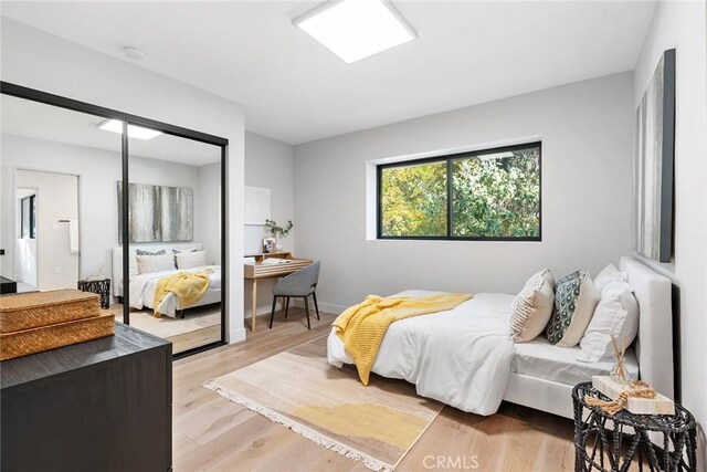 bedroom with light hardwood / wood-style flooring