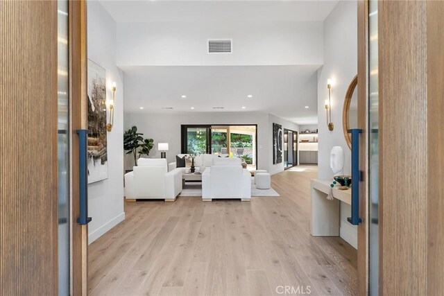 unfurnished living room featuring light hardwood / wood-style floors