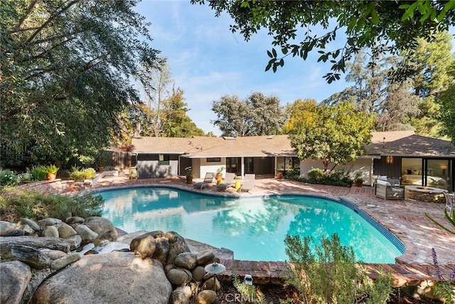 view of pool featuring a patio