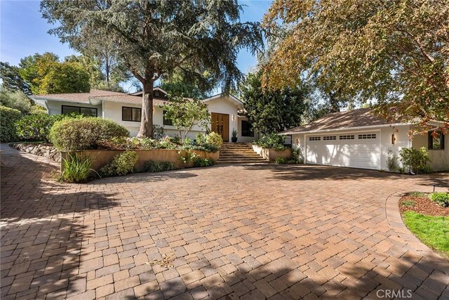 single story home featuring a garage