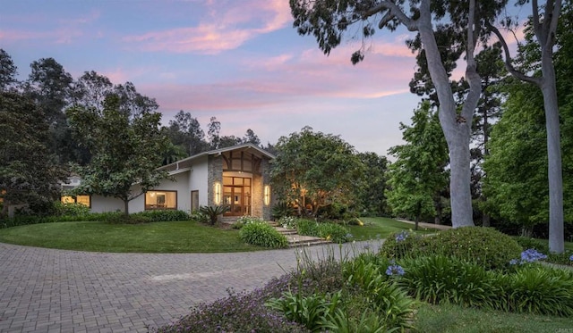 view of front of property with a yard