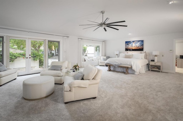 bedroom with access to outside, french doors, and carpet