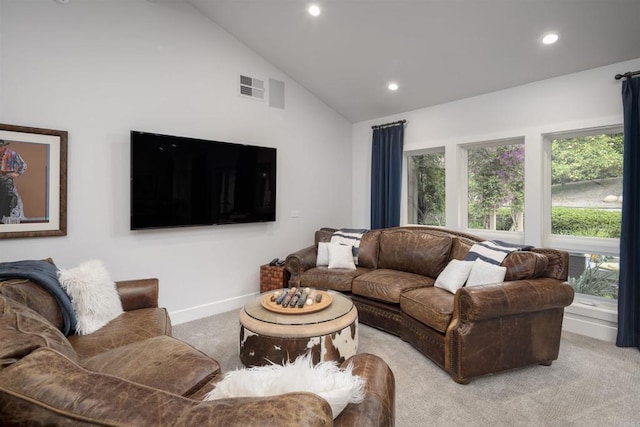 living room with lofted ceiling and light carpet