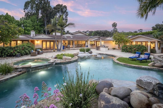 5041 El Secreto, Rancho Santa Fe, CA 92067 - view of pool featuring a patio area, french doors, and a pool with connected hot tub
