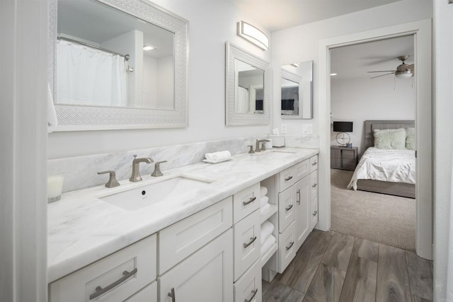 5041 El Secreto, Rancho Santa Fe, CA 92067 - ensuite bathroom with double vanity, wood finished floors, and a ceiling fan