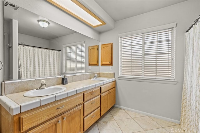 bathroom featuring vanity and tile patterned flooring