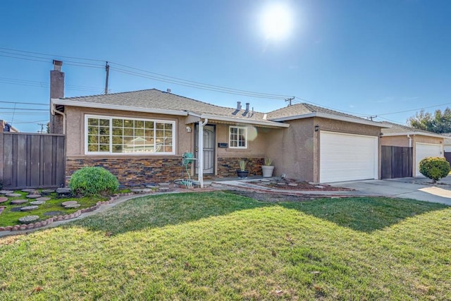 single story home featuring a front lawn and a garage