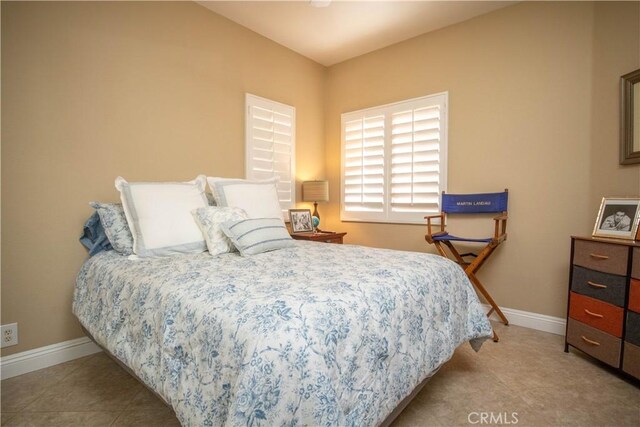 bedroom featuring light tile patterned floors