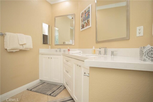 bathroom featuring tile patterned flooring and vanity