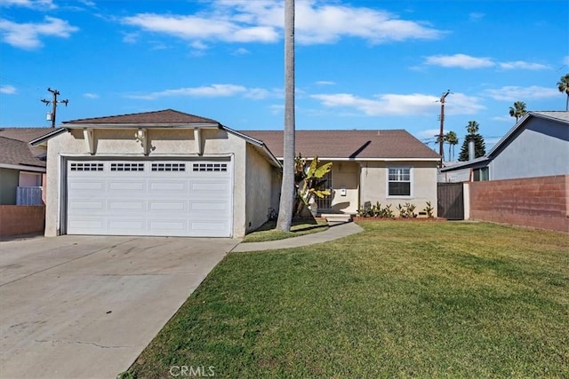 view of front of house featuring a front yard and a garage