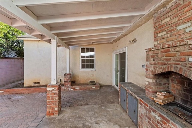 view of patio / terrace featuring an outdoor brick fireplace