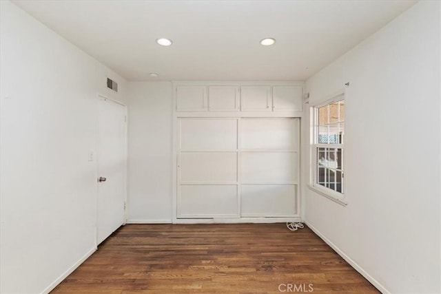 empty room featuring dark hardwood / wood-style floors