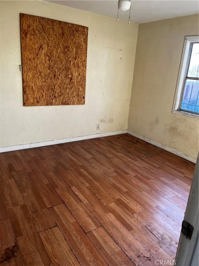 empty room featuring hardwood / wood-style floors