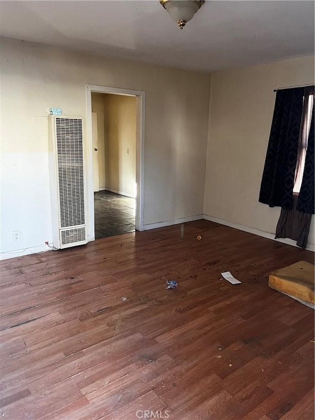 unfurnished room with hardwood / wood-style floors