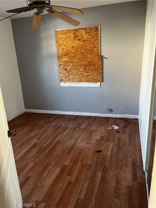 spare room featuring ceiling fan and wood-type flooring