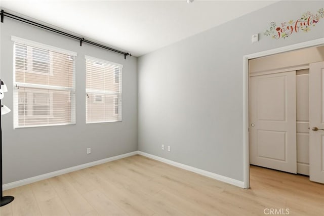 unfurnished room featuring light hardwood / wood-style floors