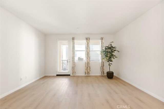 unfurnished room featuring light hardwood / wood-style flooring