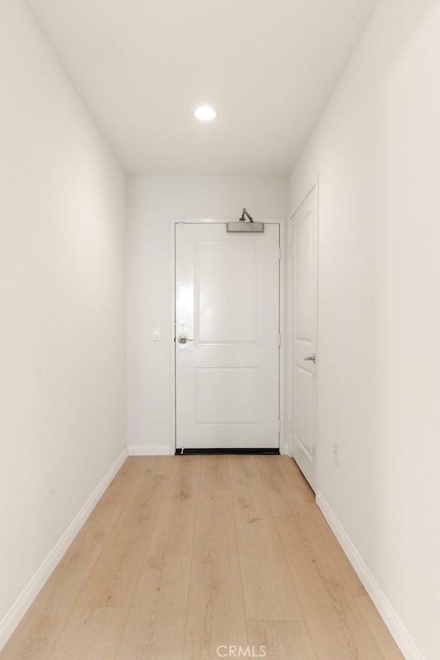 hallway with light wood-type flooring