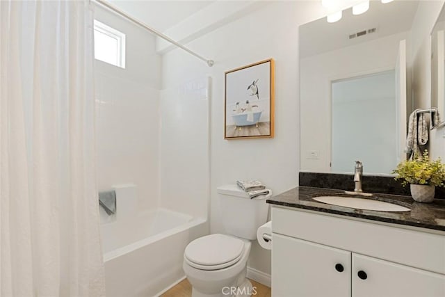 full bathroom featuring toilet, vanity, and shower / tub combination