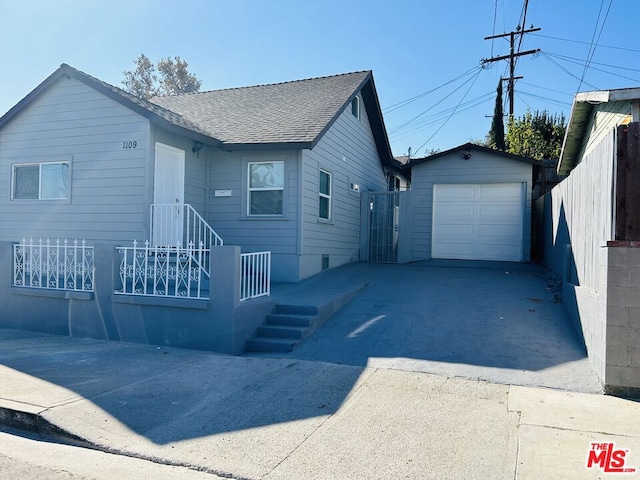 view of front of property featuring an outbuilding and a garage