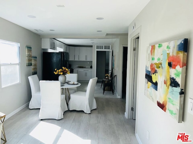 dining space featuring light hardwood / wood-style floors