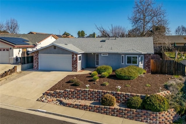 ranch-style home featuring a garage