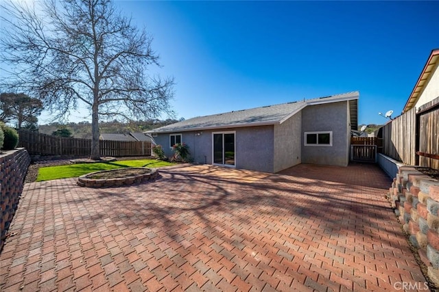 back of property featuring a patio area