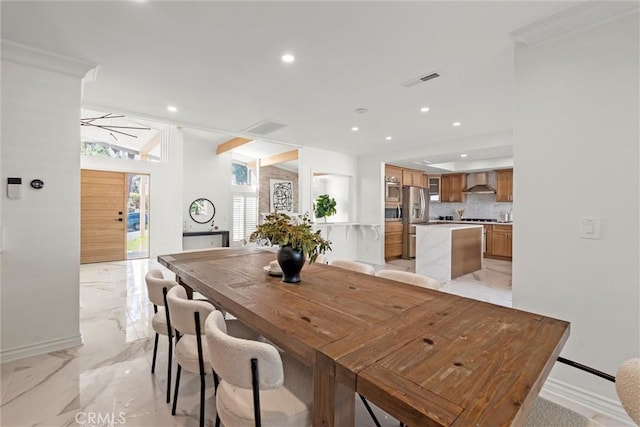 dining room with vaulted ceiling