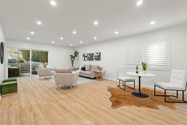 living room featuring light hardwood / wood-style flooring and a wealth of natural light